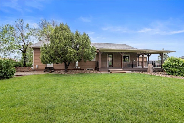 2315 Palisades Loop, Sturgis, SD 57785 - view of front facade featuring a front lawn, a porch, and a shingled roof