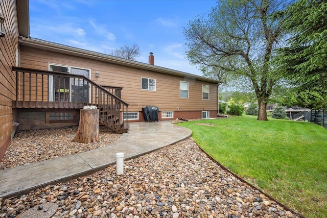 2315 Palisades Loop, Sturgis, SD 57785 - back of property with a chimney and a patio area