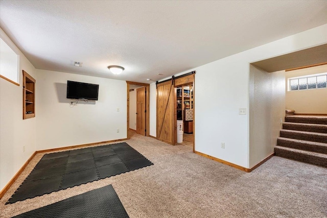2315 Palisades Loop, Sturgis, SD 57785 - basement featuring stairs, carpet floors, baseboards, and a barn door