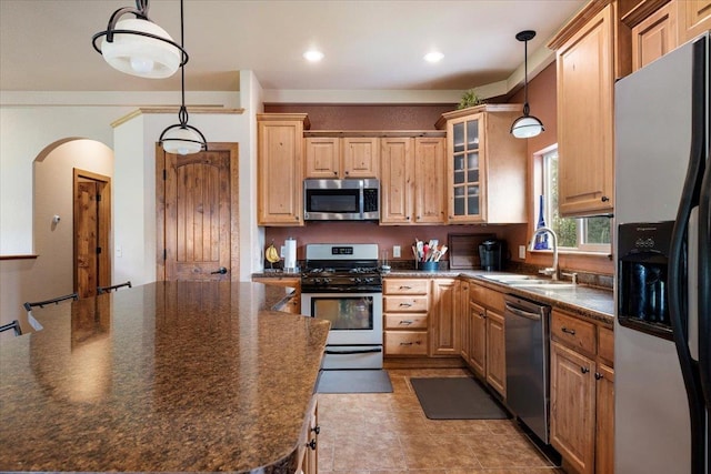 2315 Palisades Loop, Sturgis, SD 57785 - kitchen featuring appliances with stainless steel finishes, a sink, dark countertops, glass insert cabinets, and recessed lighting
