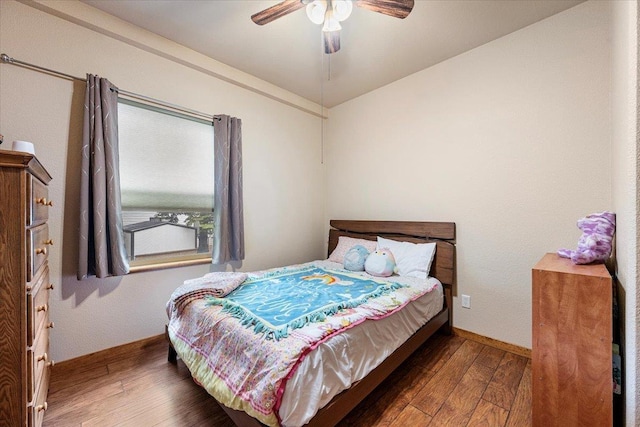 2315 Palisades Loop, Sturgis, SD 57785 - bedroom with wood-type flooring, ceiling fan, and baseboards