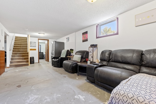2045 12th Ave, Belle Fourche, SD 57717 - living room with concrete flooring, stairway, and a textured ceiling