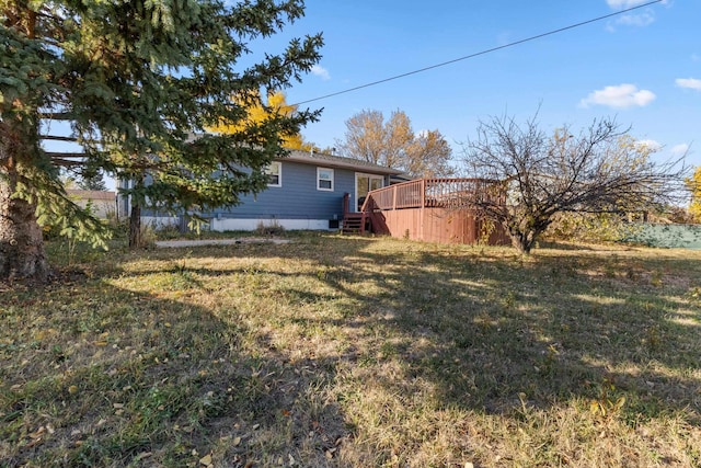 2045 12th Ave, Belle Fourche, SD 57717 - view of grassy yard featuring a wooden deck
