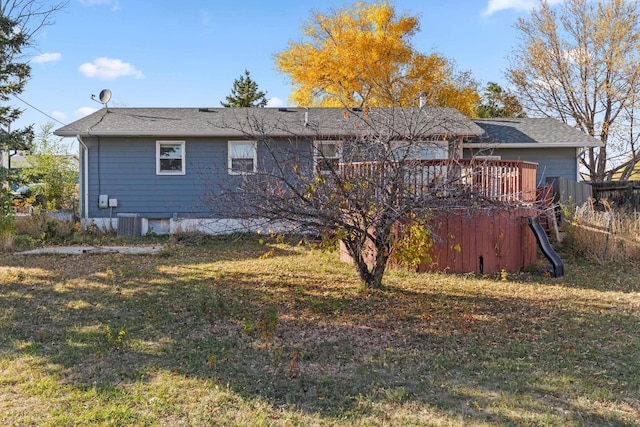 2045 12th Ave, Belle Fourche, SD 57717 - back of house featuring roof with shingles