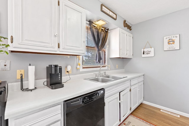 2045 12th Ave, Belle Fourche, SD 57717 - kitchen with dishwasher, a sink, white cabinets, and light countertops
