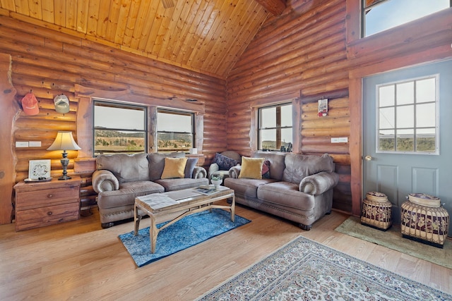 28013 Cascade Rd, Hot Springs, SD 57747 - living room with high vaulted ceiling, log walls, wood finished floors, plenty of natural light, and wood ceiling