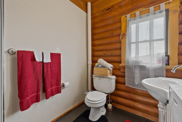 28013 Cascade Rd, Hot Springs, SD 57747 - bathroom featuring rustic walls, toilet, vanity, and baseboards