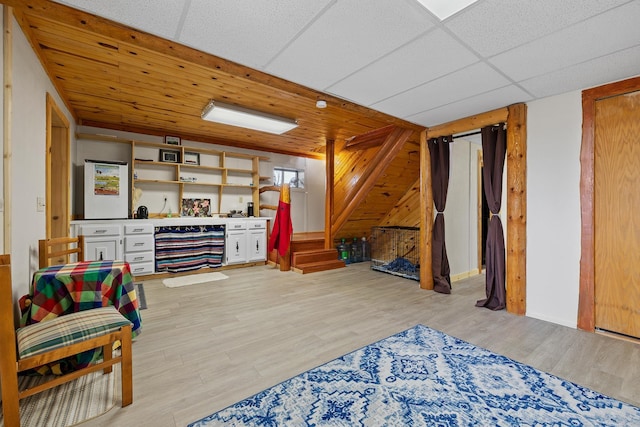 28013 Cascade Rd, Hot Springs, SD 57747 - living area with light wood-style flooring, a dry bar, and wooden walls