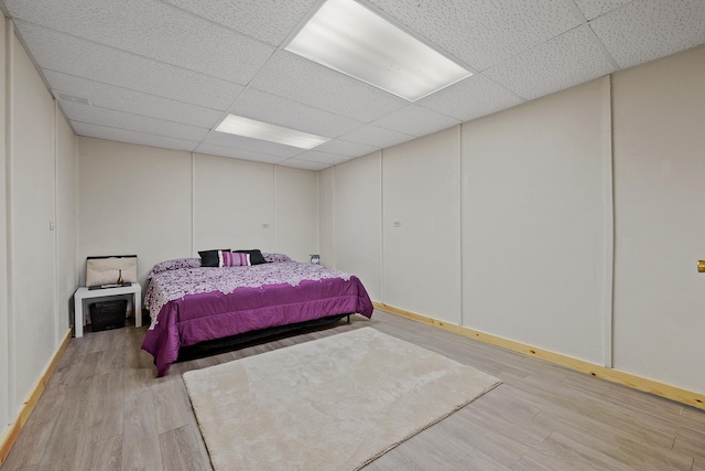 28013 Cascade Rd, Hot Springs, SD 57747 - bedroom with a paneled ceiling, light wood-style floors, and baseboards