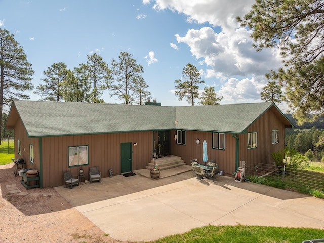 8320 Miracle Rd, Rapid City, SD 57702 - rear view of property with roof with shingles and a patio