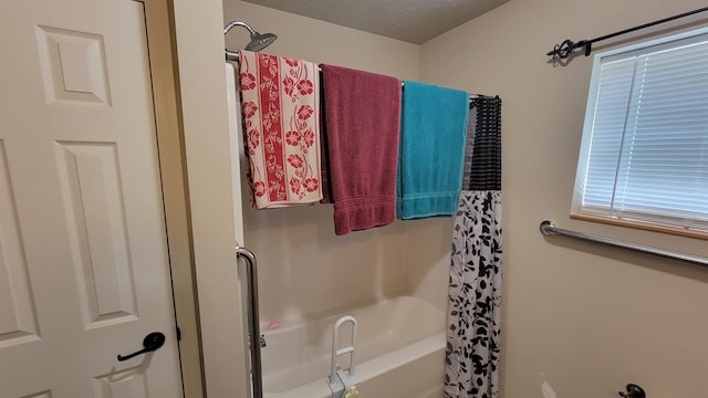 102 10th Ave, Belle Fourche, SD 57717 - full bath with a textured ceiling and shower / bath combo