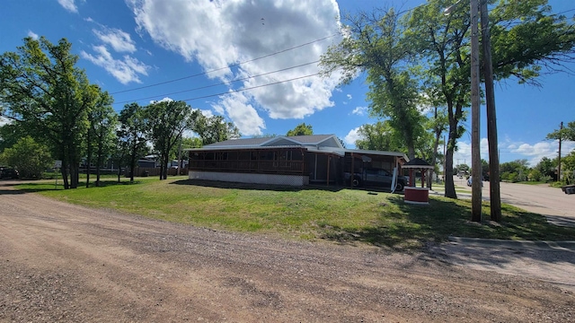 102 10th Ave, Belle Fourche, SD 57717 - view of home's exterior with a yard and driveway