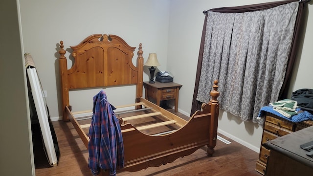 102 10th Ave, Belle Fourche, SD 57717 - bedroom with wood finished floors and baseboards
