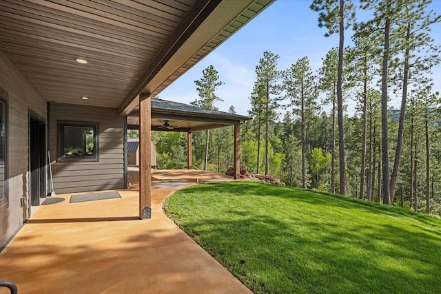 3135 American Eagle Rd, Spearfish, SD 57783 - view of grassy yard featuring a patio and a ceiling fan