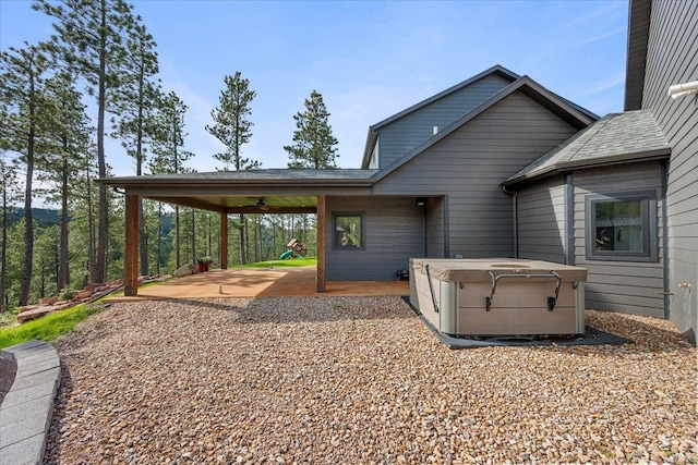 3135 American Eagle Rd, Spearfish, SD 57783 - view of patio with a hot tub, ceiling fan, and an attached carport