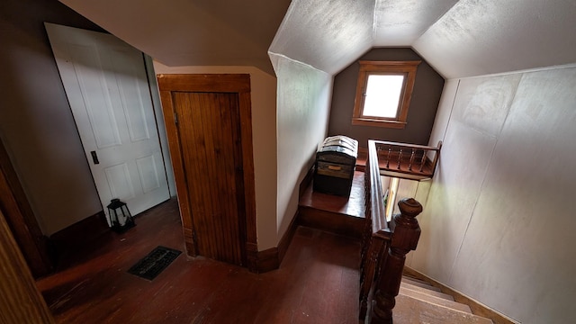 57 Lincoln Ave, Deadwood, SD 57732 - staircase featuring vaulted ceiling, wood finished floors, a textured ceiling, and baseboards