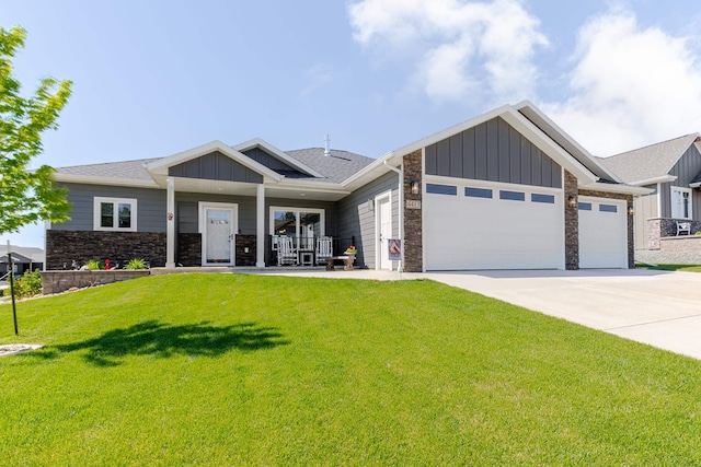 4413 Targhee Dr, Rapid City, SD 57702 - craftsman-style house with board and batten siding, stone siding, a garage, and driveway
