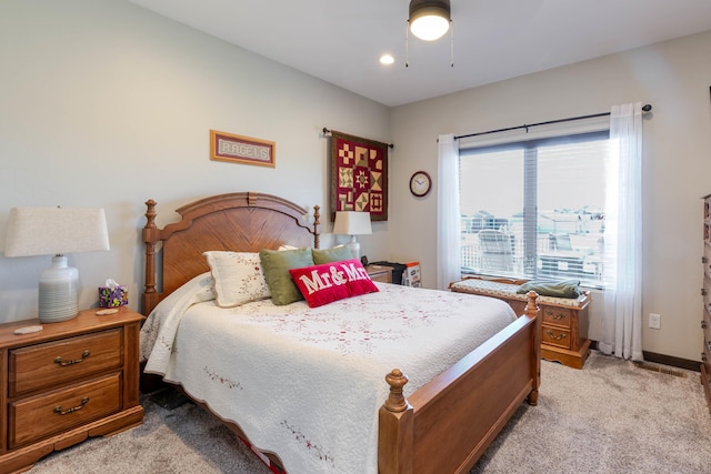 4413 Targhee Dr, Rapid City, SD 57702 - bedroom with light carpet, ceiling fan, and baseboards