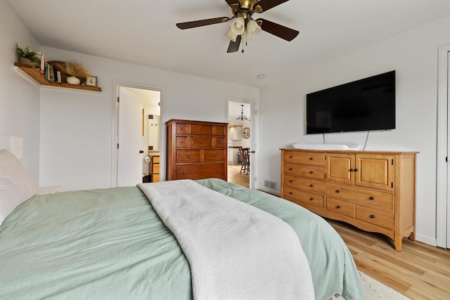 491 Freude Ln, Box Elder, SD 57719 - bedroom with light wood-style flooring and ceiling fan