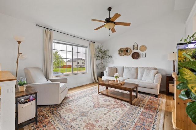 491 Freude Ln, Box Elder, SD 57719 - living area featuring vaulted ceiling, a ceiling fan, and wood finished floors