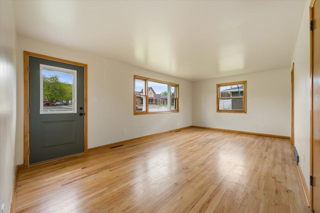 1041 State St, Spearfish, SD 57783 - foyer entrance with plenty of natural light, light wood-style floors, and baseboards