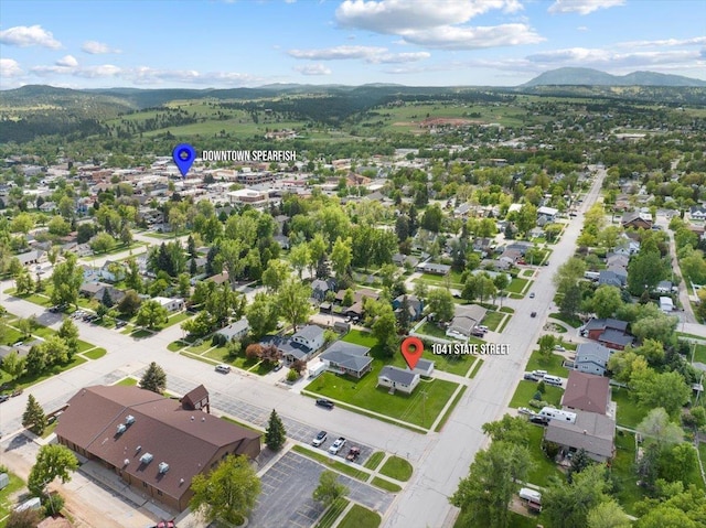 1041 State St, Spearfish, SD 57783 - aerial perspective of suburban area with a mountain backdrop