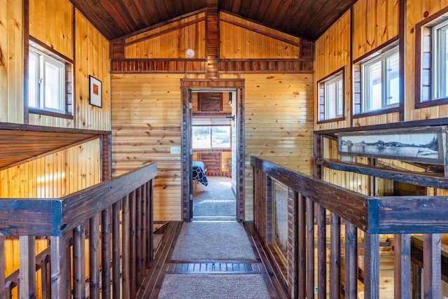 25426 Sidney Park Rd, Custer, SD 57730 - corridor featuring lofted ceiling, wooden ceiling, wooden walls, and carpet floors