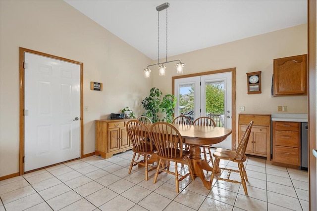 1006 S 33rd St, Spearfish, SD 57783 - dining area with vaulted ceiling, light tile patterned flooring, and baseboards