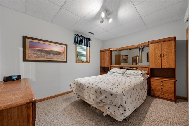1006 S 33rd St, Spearfish, SD 57783 - bedroom featuring light colored carpet, a paneled ceiling, and baseboards