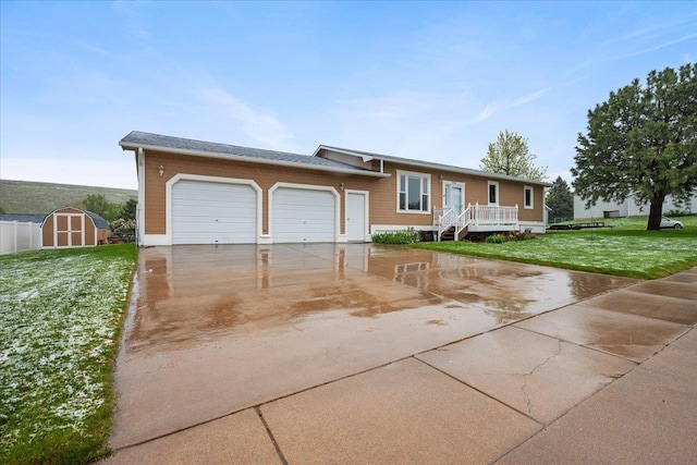 1006 S 33rd St, Spearfish, SD 57783 - view of front of house with an attached garage, concrete driveway, and a front yard