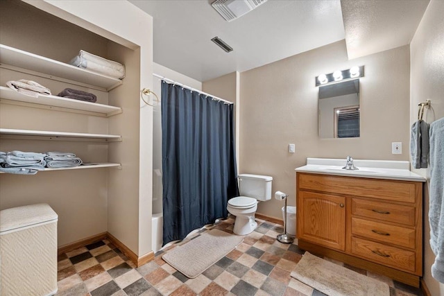 1006 S 33rd St, Spearfish, SD 57783 - full bath with tile patterned floors, toilet, vanity, and baseboards