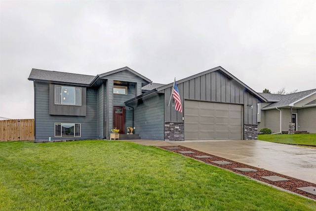 6575 Astoria Ln, Summerset, SD 57718 - view of front facade with board and batten siding, a garage, and concrete driveway