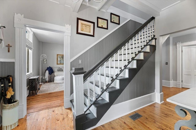 118 S Galena St, Lead, SD 57754 - stairs with wood-type flooring, beam ceiling, and baseboards