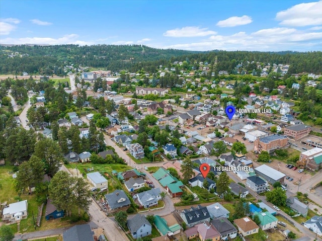 118 S Galena St, Lead, SD 57754 - aerial view of property and surrounding area featuring a heavily wooded area and nearby suburban area