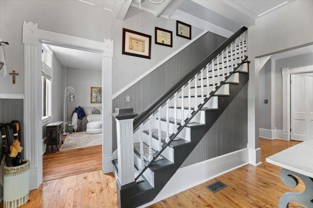 1231/2 Stone St, Lead, SD 57754 - stairs with wood-type flooring, beam ceiling, and baseboards