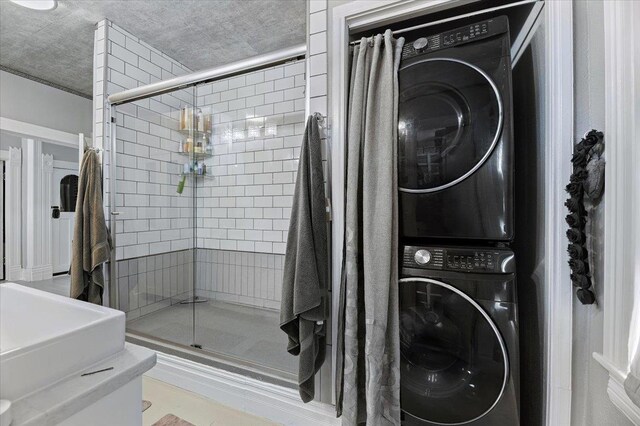 1231/2 Stone St, Lead, SD 57754 - bathroom with stacked washer and clothes dryer and a shower stall