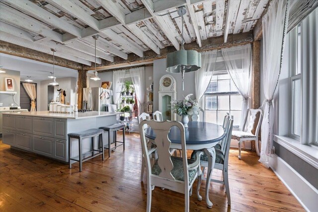 1231/2 Stone St, Lead, SD 57754 - dining room featuring wood-type flooring and beamed ceiling