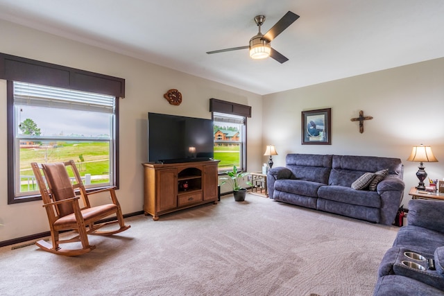 151 Surrey Ln, Custer, SD 57730 - living room featuring light colored carpet, a ceiling fan, and baseboards