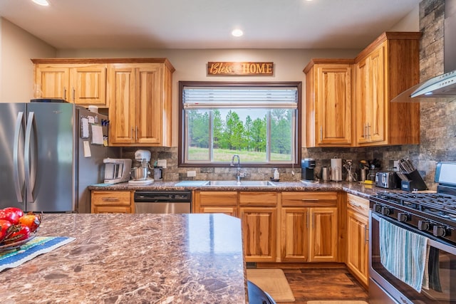 151 Surrey Ln, Custer, SD 57730 - kitchen featuring stainless steel appliances, wall chimney exhaust hood, a sink, recessed lighting, and backsplash