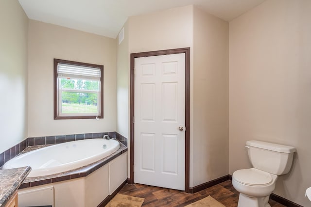 151 Surrey Ln, Custer, SD 57730 - bathroom with wood finished floors, a garden tub, toilet, and vanity