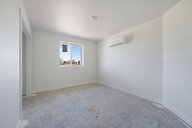 10884 Eagle Ct, Belle Fourche, SD 57717 - empty room with a wall mounted AC, unfinished concrete floors, and baseboards