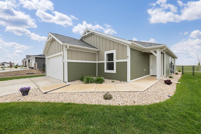 516 Aaron Ct, Rapid City, SD 57703 - view of property exterior featuring board and batten siding, a garage, driveway, and roof with shingles
