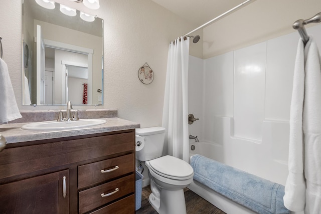 516 Aaron Ct, Rapid City, SD 57703 - full bath featuring vanity, toilet, shower / bath combination with curtain, and wood finished floors