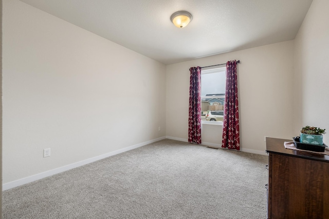 516 Aaron Ct, Rapid City, SD 57703 - empty room with carpet flooring and baseboards