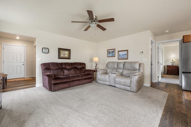 516 Aaron Ct, Rapid City, SD 57703 - living room with a ceiling fan, baseboards, and dark carpet