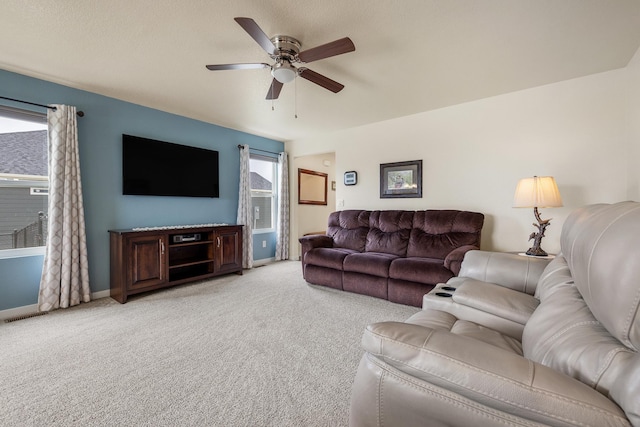 516 Aaron Ct, Rapid City, SD 57703 - living room featuring light colored carpet, ceiling fan, and baseboards