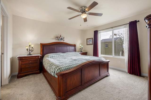 516 Aaron Ct, Rapid City, SD 57703 - bedroom featuring light carpet, baseboards, and a ceiling fan
