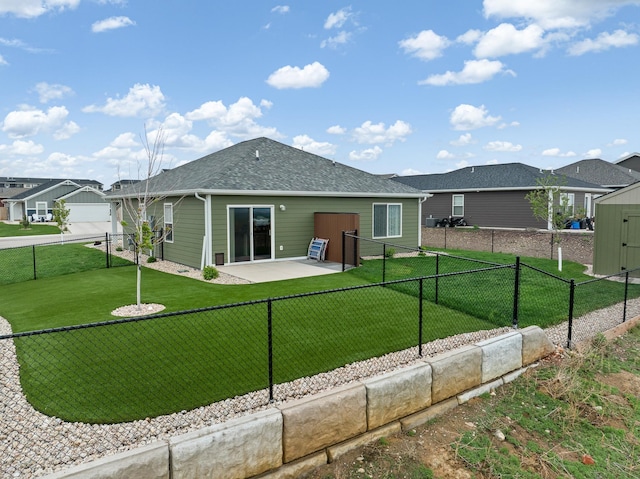 516 Aaron Ct, Rapid City, SD 57703 - back of property with a shingled roof and a patio