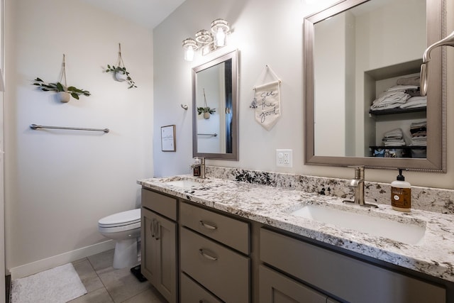2259 Suntory Ave, Spearfish, SD 57783 - full bathroom featuring double vanity, toilet, tile patterned floors, and baseboards