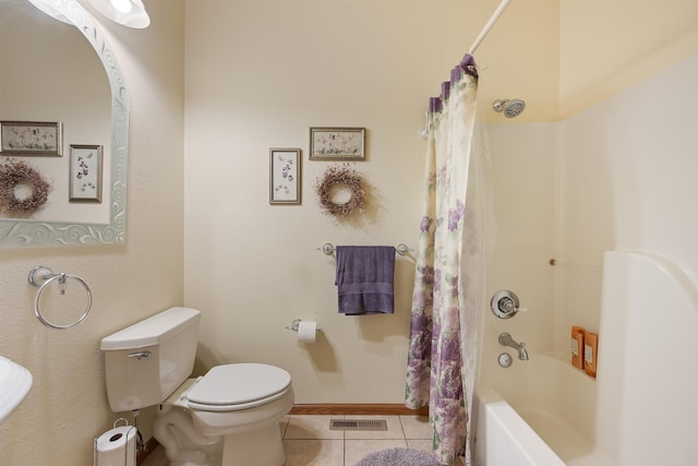 2340 Camaro Cir, Sturgis, SD 57785 - bathroom featuring toilet, tile patterned flooring, shower / bath combination with curtain, and baseboards